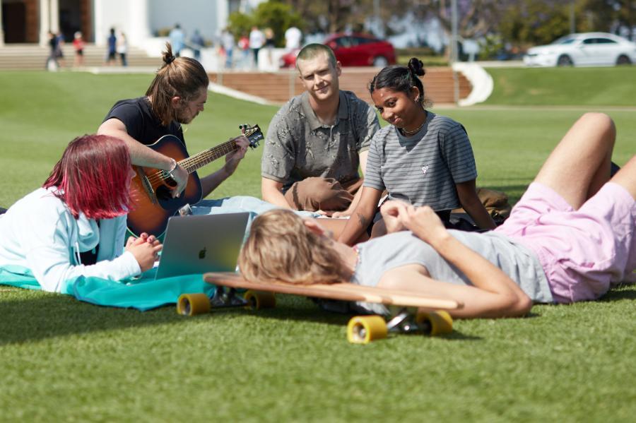 group of students relaxing at Sunken Garden